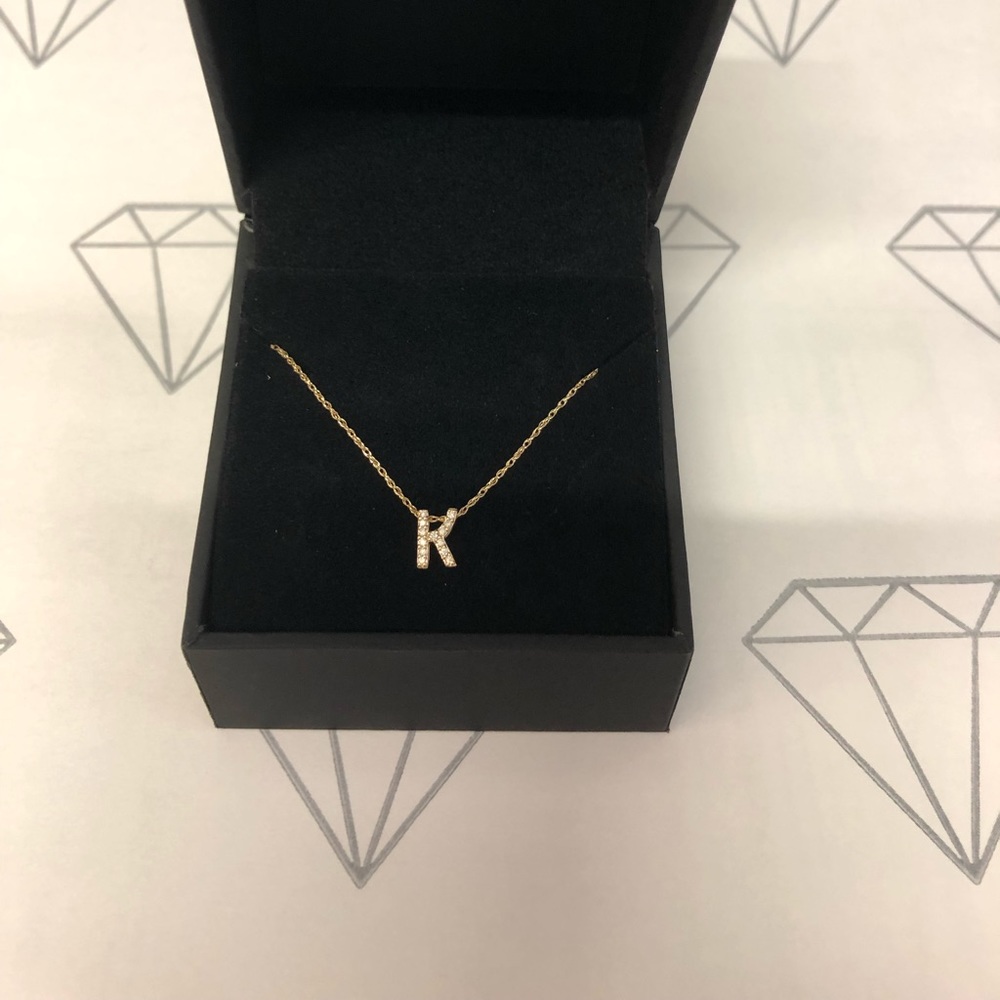 10k yellow gold necklace with chain, letter initial “K” with small diamonds